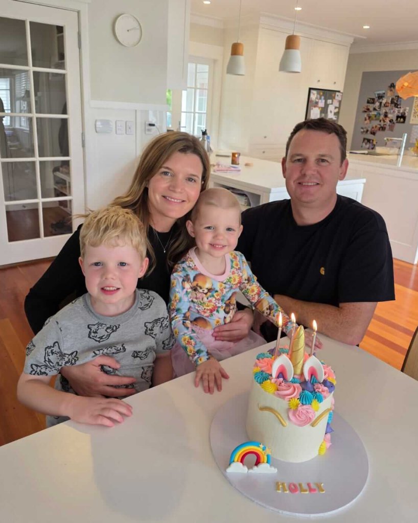 Holly and her family with a birthday cake